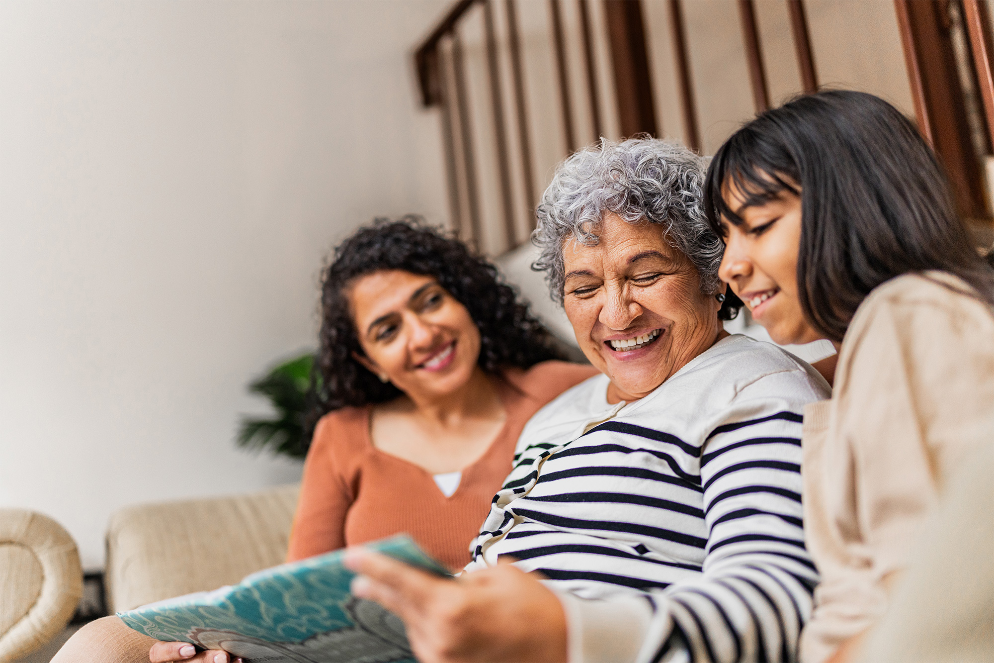 Elderly woman with grandchildren looking at tablet together