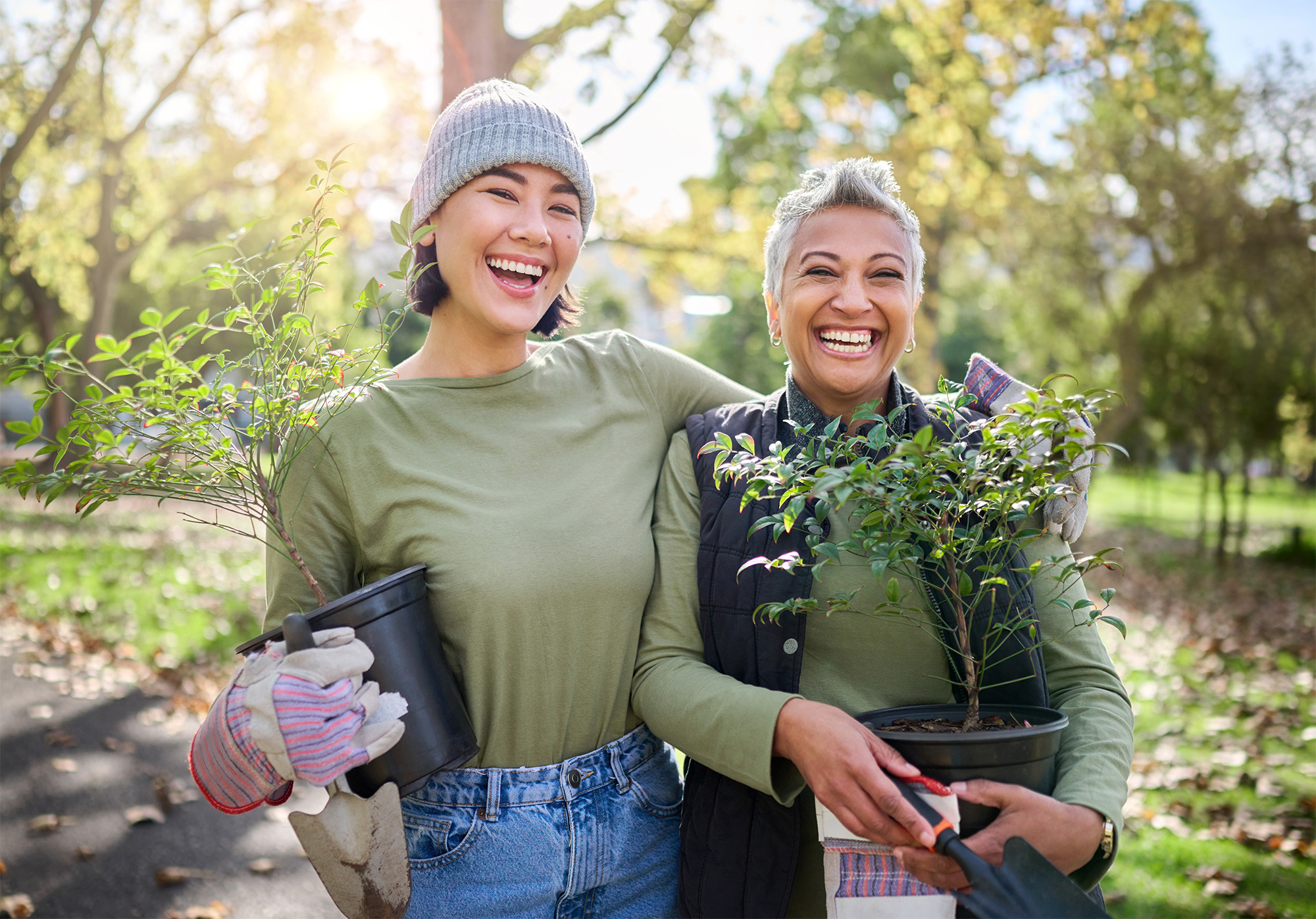 Two women gardening outside on sunny day
